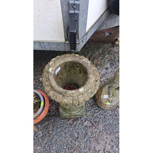77 - One cast stone garden urn planter, the flared bowl with scalloped rim and applied rose garland relie... 
