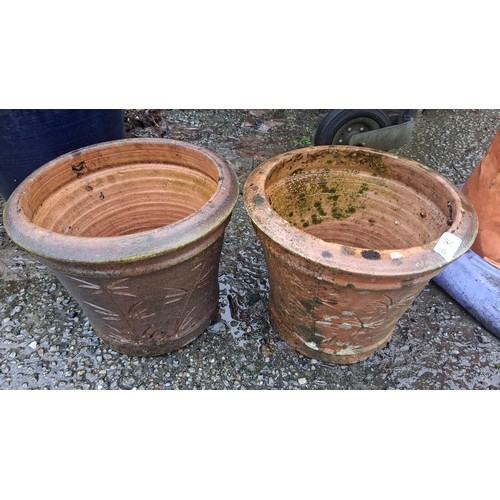 81 - Pair of large terracotta garden planters, each of tapering cylindrical form with rolled rim and inci... 