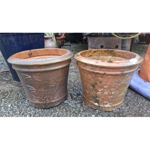 81 - Pair of large terracotta garden planters, each of tapering cylindrical form with rolled rim and inci... 