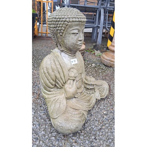 95 - A cast stone garden figure of Buddha seated in meditation, with stylised curled hair and floral robe... 