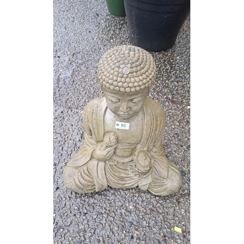 95 - A cast stone garden figure of Buddha seated in meditation, with stylised curled hair and floral robe... 