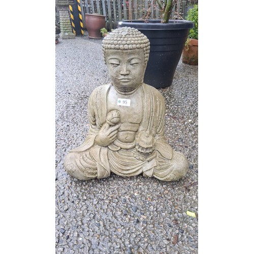 95 - A cast stone garden figure of Buddha seated in meditation, with stylised curled hair and floral robe... 