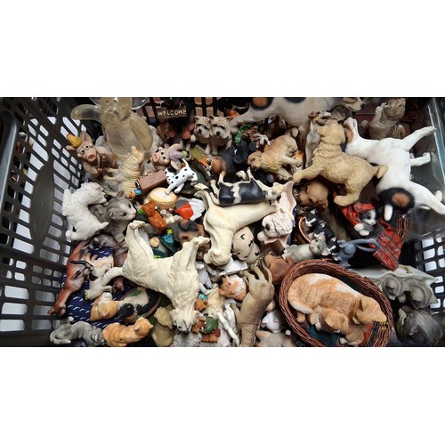 A group of assorted animal figurines and character toys, including dogs ...
