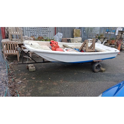 A Dell Quay Dory 13 fibreglass dinghy on a single-axle road trailer, with Chrysler 20 outboard motor and loose marine equipment including fuel cans, fenders and timber supports.