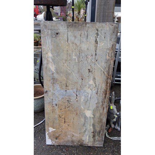 A large rectangular marble slab, grey ground with white veining and ...