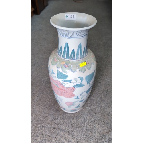A transfer-printed and enamelled ceramic baluster vase, with flared rim ...