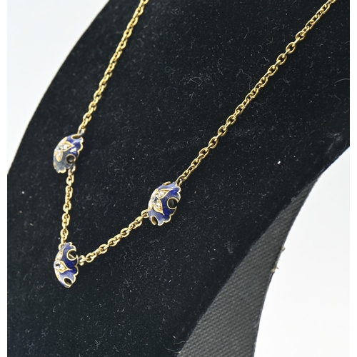 4 - Enamel and diamond necklace, designed as a yellow metal chain set to the front with three spaced blu... 