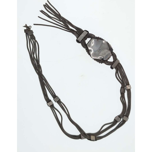 6 - Silver tassel necklace set with a butterscotch amber coloured bead, marked '925', gross weight 60 gr... 