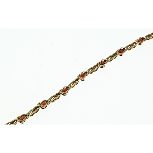 8 - 9ct gold, garnet and diamond bracelet, hallmarked, length 195mm, gross weight 7.9 grams