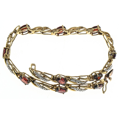 8 - 9ct gold, garnet and diamond bracelet, hallmarked, length 195mm, gross weight 7.9 grams