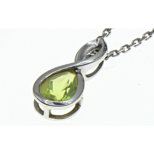 9 - 9ct white gold peridot set pendant and 9ct white gold chain, hallmarked, length 15mm and 410mm respe... 
