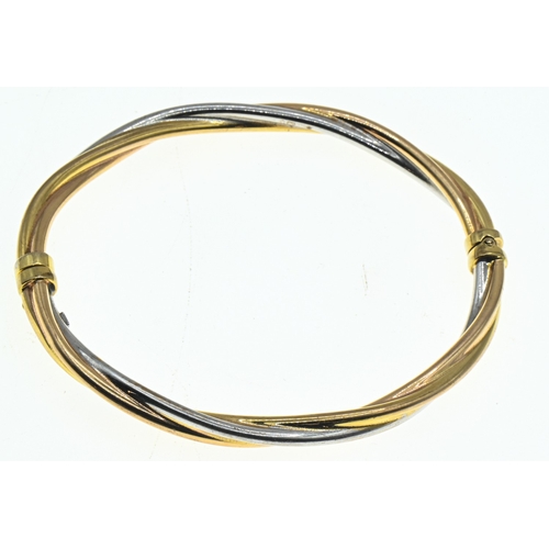 29 - 9ct tri-coloured gold twist design hinged bracelet, hallmarked, inner width 60mm, gross weight 6.6 g... 