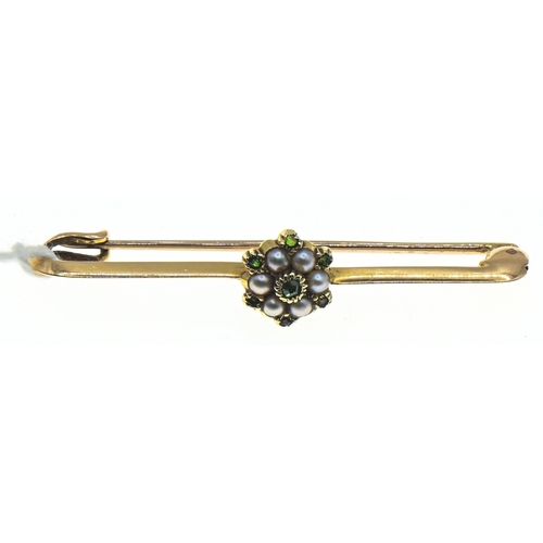 31 - Yellow metal mounted seed pearl and green stone cluster bar brooch, scratch marked '15CT', length 42... 