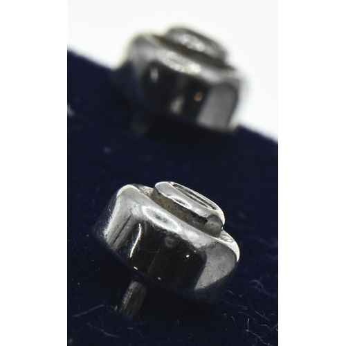 32 - Pair of 9ct white gold and diamond ear studs, hallmarked, diameter 6mm, gross weight 1.45 grams... 