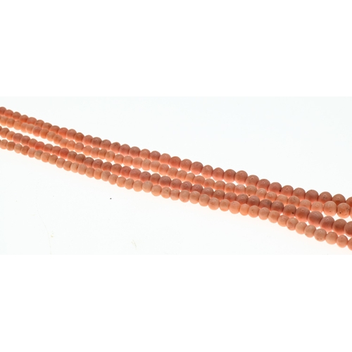 34 - Double strand graduated coral necklace, with a yellow metal barrel clasp marked '9CT', inner strand ... 