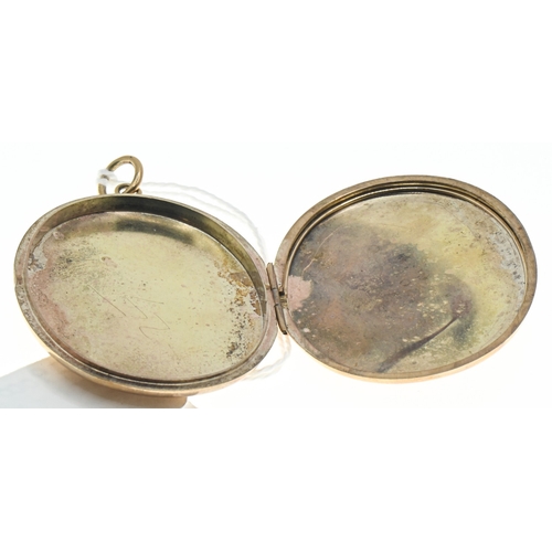 35 - Large 9ct gold oval locket, hallmarked,&nbsp;with foliate pattern to the front, length including bal... 
