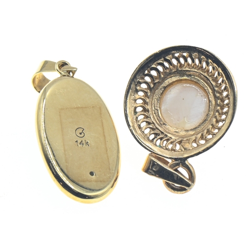 55 - Two yellow metal mounted pendants, including one set with butterfly wing marked '14K' and another wi... 