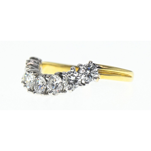 74 - 18ct gold and seven diamond ring, hallmarked, the diamonds together estimated to weigh 1.68 carats, ... 