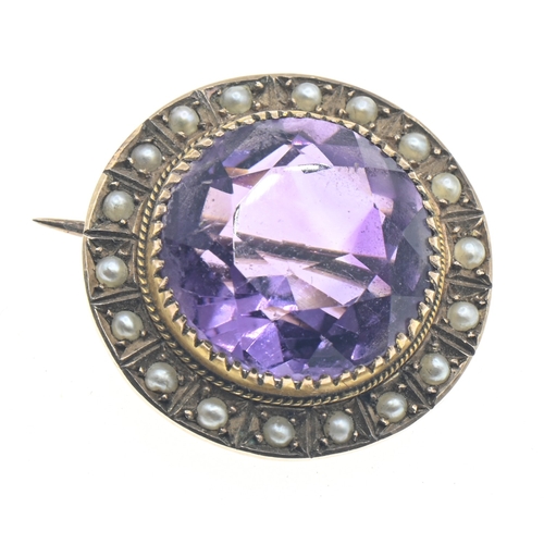 76 - Amethyst and seed pearl set circular brooch, marked '9CT', diameter 20mm, gross weight 4.35 grams... 
