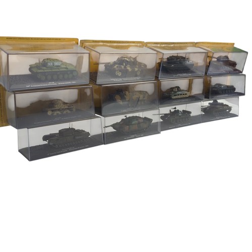 A group of die-cast military vehicle scale models, each mounted on a ...