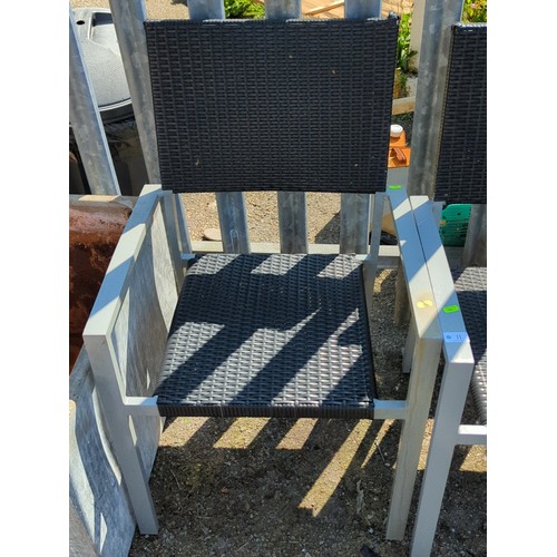 11 - A pair of contemporary garden armchairs, each with a grey metal frame and open arms, the seat and re... 