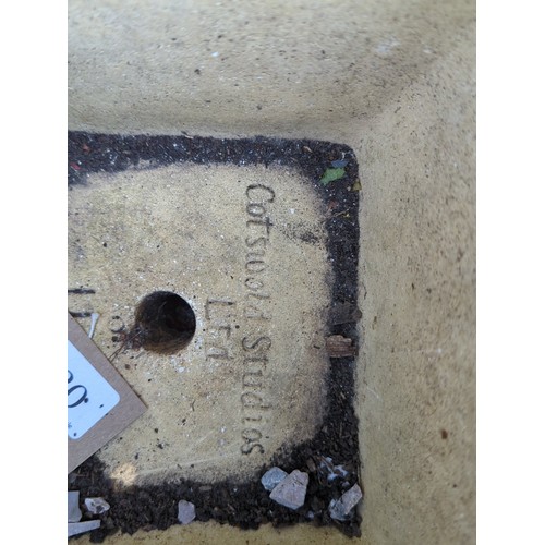 20 - Two concrete garden planters: one square trough with pebbled ground and relief oak-leaf cartouche; t... 