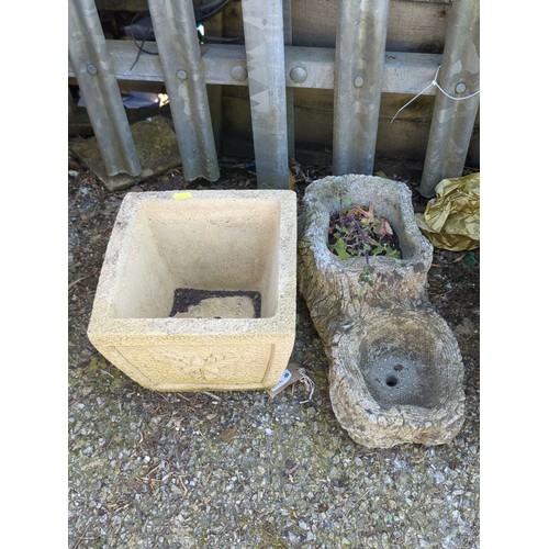 20 - Two concrete garden planters: one square trough with pebbled ground and relief oak-leaf cartouche; t... 