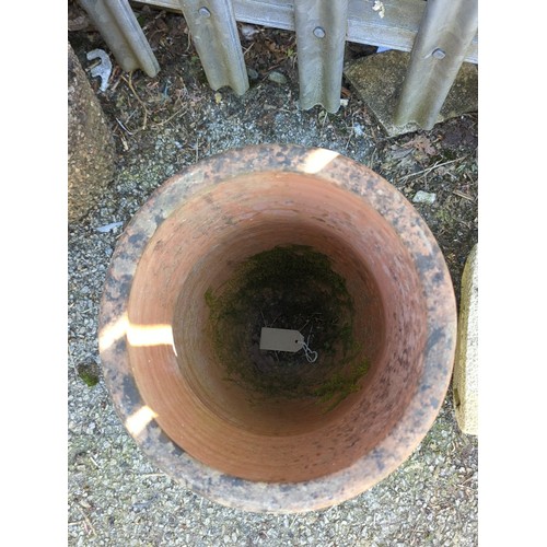 21 - Large terracotta garden planter of tapering cylindrical form with a single drainage aperture near th... 