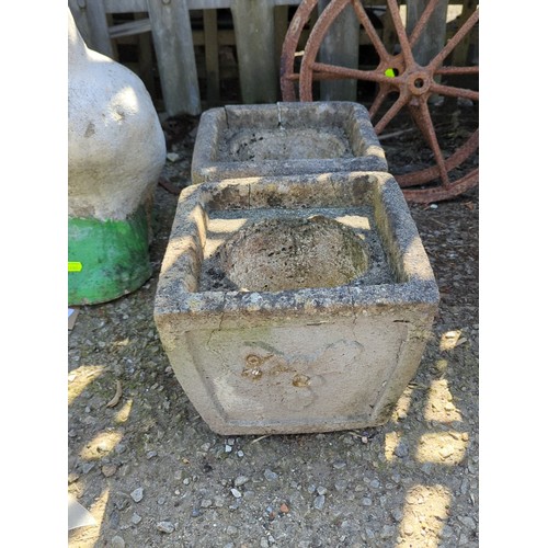 3 - A pair of concrete square garden planters, each with a circular recessed well and moulded panel deco... 