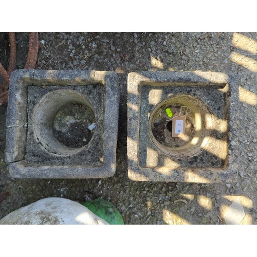 3 - A pair of concrete square garden planters, each with a circular recessed well and moulded panel deco... 