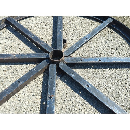 32A - Industrial steel wheel frame of circular rimmed form with eight radiating box-section spokes, drille... 