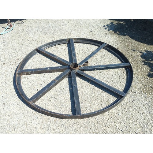 32A - Industrial steel wheel frame of circular rimmed form with eight radiating box-section spokes, drille... 