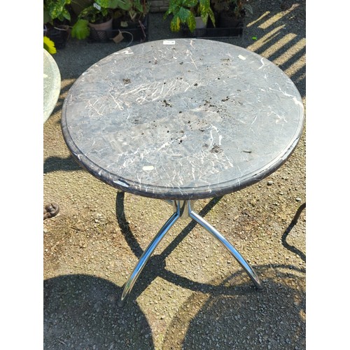 40 - Contemporary bistro table with circular grey marble-effect top, the rimmed edge above a polished chr... 