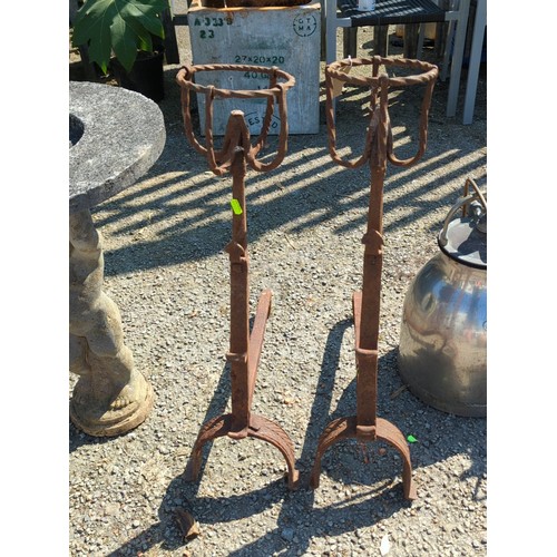 48 - A pair of wrought-iron fire dogs.