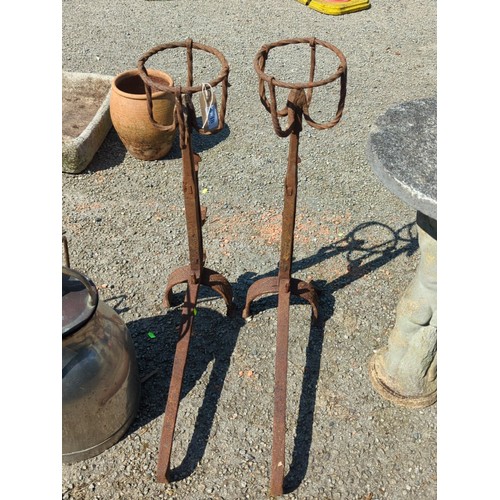48 - A pair of wrought-iron fire dogs.