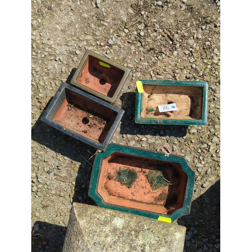 52 - A group of glazed stoneware bonsai planters of rectangular and square form, in green and dark glazes... 