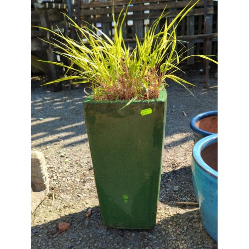 55 - Glazed ceramic planter of square tapering form, finished in mottled green glaze with thickened rim; ... 