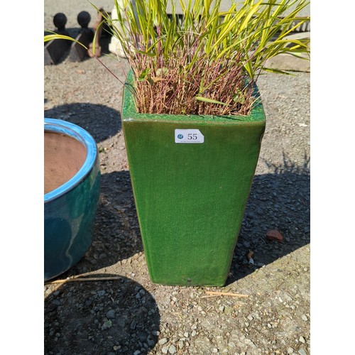 55 - Glazed ceramic planter of square tapering form, finished in mottled green glaze with thickened rim; ... 