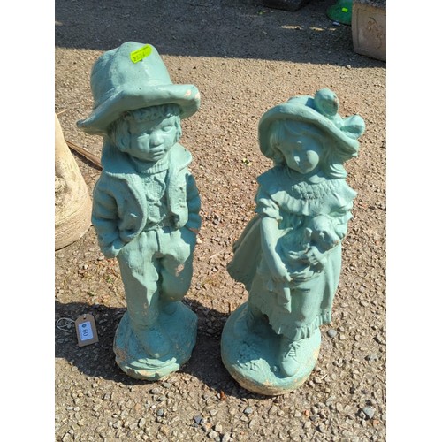 60 - A pair of painted concrete garden figures modelled as children in period dress—one a boy in brimmed ... 