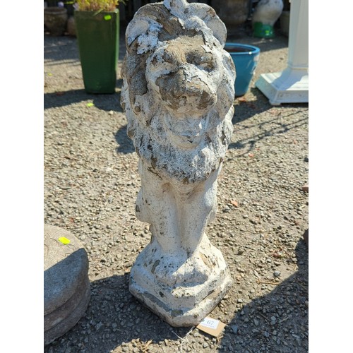 67 - Concrete garden figure of a seated lion, modelled with stylised mane and expressive mask, raised on ... 