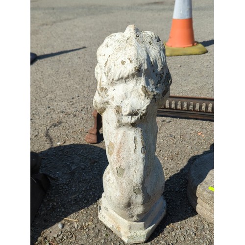 67 - Concrete garden figure of a seated lion, modelled with stylised mane and expressive mask, raised on ... 