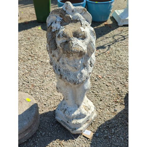 67 - Concrete garden figure of a seated lion, modelled with stylised mane and expressive mask, raised on ... 