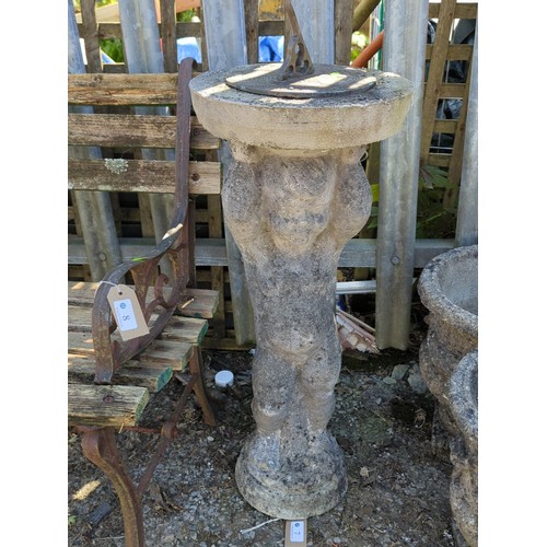 7 - Concrete figural sundial pedestal modelled as a putto supporting a circular slab, mounted with a met... 