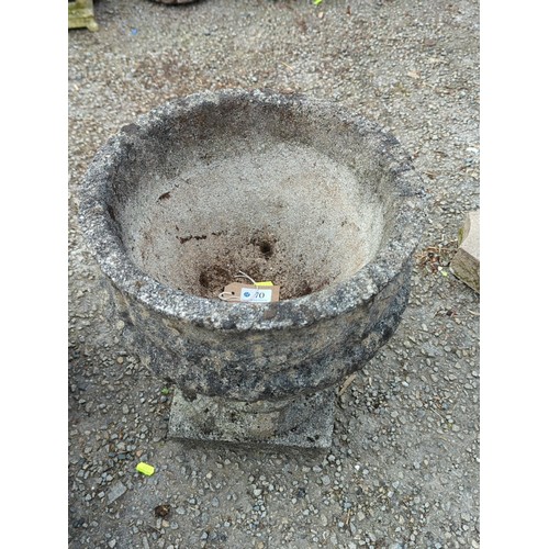 70 - Concrete garden urn of campana form, the exterior moulded with swags and stiff-leaf ornament, raised... 