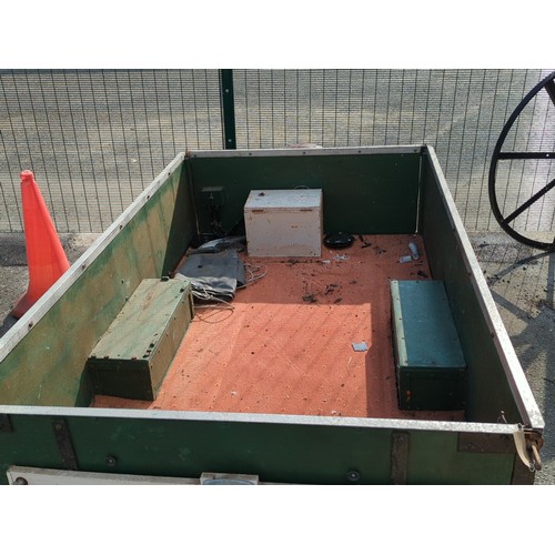 75 - Single-axle utility trailer with green panelled sides and steel frame, open box body with internal s... 