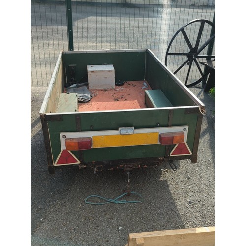 75 - Single-axle utility trailer with green panelled sides and steel frame, open box body with internal s... 
