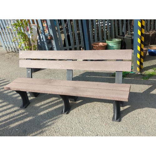 76 - Contemporary outdoor bench with moulded faux-wood slats forming a two-plank seat and twin back rails... 