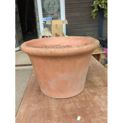 78 - Large terracotta garden flowerpot of tapering cylindrical form with broad rolled rim and drainage ho... 