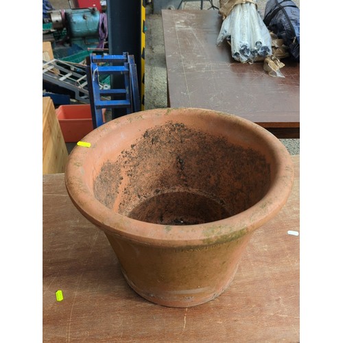 78 - Large terracotta garden flowerpot of tapering cylindrical form with broad rolled rim and drainage ho... 