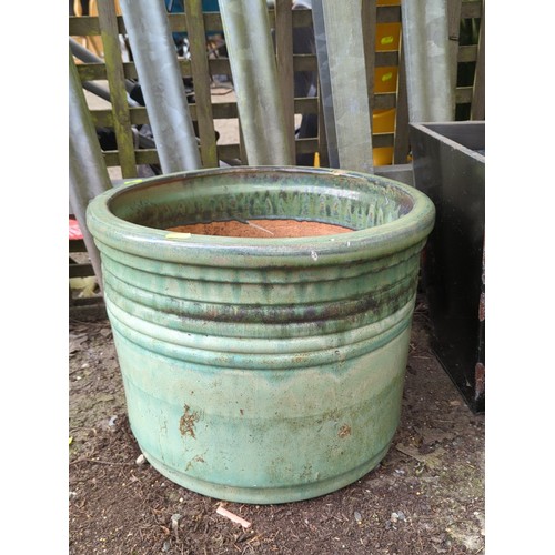 79 - Large glazed stoneware jardinière of cylindrical form with everted rim and moulded horizontal bands... 